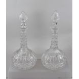 A PAIR OF VICTORIAN ONION SHAPED CUT GLASS DECANTERS with stoppers