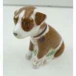 A ROYAL CROWN DERBY PAPERWEIGHT "Colin", the puppy, a limited edition no. 315/500, 7.5cm high with