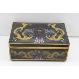 A 20TH CENTURY CLOISONNE TABLE CASKET, the black ground, decorated with five-toe dragons pursuing