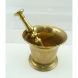 AN 18TH CENTURY BRONZE PESTLE AND MORTAR, the flared rim mortar is 11cm high