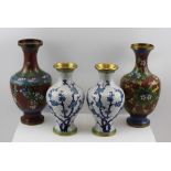 A PAIR OF 20TH CENTURY CLOISONNE WHITE GROUND VASES, with blue blossom decoration, 18cm high,