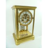 A LATE 19TH CENTURY FRENCH FOUR GLASS MANTEL CLOCK, having gilt brass frame, the dial with