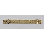 A 9CT GOLD BRACELET of strap and buckle design, 1.7cm wide, weight 61g.