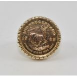 A 1/10 KRUGERRAND COIN set into a 9CT GOLD RING