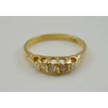 A FIVE STONE DIAMOND RING set in an 18ct gold band, total weight 2g, ring size J
