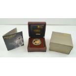 "THE ROYAL MINT" A limited proof edition £5, 22ct gold coin, a presentation piece in polished wood