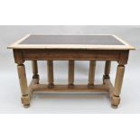 A 19TH CENTURY FRENCH LIBRARY TABLE, having stripped, possibly chestnut, frame, inset rexine top,