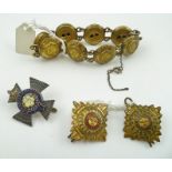 A BRACELET made from early 20th century military "Royal Engineers" coat buttons, two shoulder pips