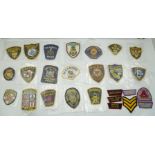 A COLLECTION OF FORTY-THREE EMBROIDERED FABRIC POLICE BADGES and other law enforcement, mainly
