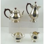 SELFRIDGE & CO. LTD. A GEORGIAN DESIGN FOUR PIECE SILVER TEASET comprising; teapot, hot water jug,