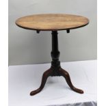 A GEORGE III OAK SNAP-TOP OCCASIONAL TABLE raised on turned stem with three arched supports, top