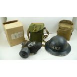 A WORLD WAR II "POLICE" TIN HELMET, together with a gas mask in canvas case and one other canvas bag