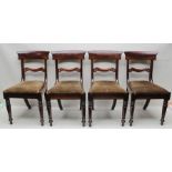 A SET OF FOUR WILLIAM IV MAHOGANY DINING CHAIRS having drop-in upholstered seats, on ring turned