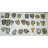 A COLLECTION OF FIFTY EMBROIDERED FABRIC POLICE BADGES and other law enforcement, mainly American