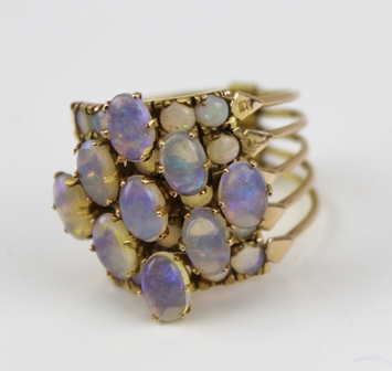 A LADY'S DRESS RING, comprising five hinged sections of yellow metal, set with opals, size O - Image 3 of 3