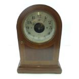 AN EDWARDIAN "BULLE" ELECTRIC MANTEL CLOCK, having arched top mahogany case with string inlay, the