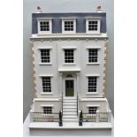 A WELL MODELLED FOUR STOREY GEORGIAN DESIGN DOLLS HOUSE with eight rooms, central hall and staircase