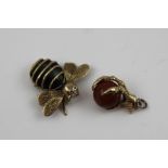 TWO 9CT GOLD CHARMS one modelled as a claw holding a stone ball, the other a 9ct gold bee with