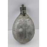 A GERMAN SECOND WORLD WAR ALUMINIUM WATER BOTTLE, having chased decoration of symbols and text, "