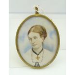 A 19TH CENTURY OVAL MINIATURE PAINTING ON IVORY, sitter is Dora Broughton, daughter of Capt