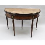 A 19TH CENTURY CENTURY MAHOGANY DEMI-LUNE FOLDOVER CARD TABLE having brass inlay decoration,