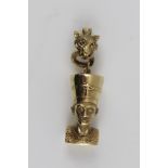 A 9CT GOLD PENDANT in the form of Queen Nefertiti, the mount in the form of a Leopards head, with