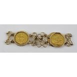 A GOLD BRACELET, set with four sovereigns, dated 1908, two dated 1911 and one dated 1918, the