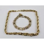 A 9CT GOLD GATE LINK BRACELET with padlock clasp, 11g., and a 14k fancy link NECKLACE, 9g. (2)