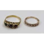 A 9CT GOLD HALF ETERNITY RING set with seven stones, together with a garnet set 9ct gold LADY'S RING