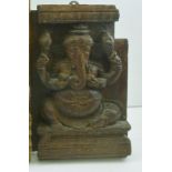 AN INDIAN CARVED HARDWOOD PANEL depicting "Ganesh", believed to be from a Southern Indian