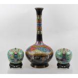 A PAIR OF 20TH CENTURY CLOISONNE JARS WITH COVERS, having jade green ground, decorated with items of