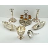 A SHEFFIELD PLATED EGG CRUET, WINE FUNNEL, PAIR OF CANDLESTICKS, TWO CANDLE SNUFFERS ON TRAYS, and a