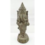 AN 18TH CENTURY INDIAN CAST BRONZE HINDU GOD GANESH, remains of green paint finish, standing upon