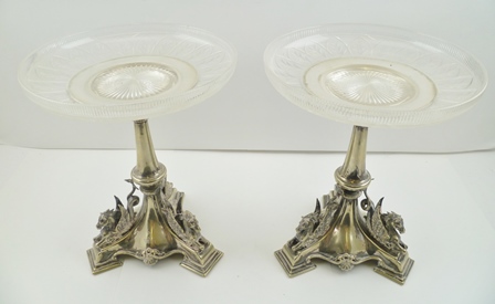 A PAIR OF VICTORIAN SILVER PLATED COMPORTS, fitted cut and etched glass dish tops, on plated