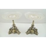 A PAIR OF VICTORIAN SILVER PLATED COMPORTS, fitted cut and etched glass dish tops, on plated