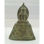 A KHMER BRONZE SEATED BUDDHA, raised upon a complex tapering base with kneeling acolytes, considered