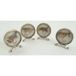 GREY AND CO. A CASED SET OF FOUR EDWARDIAN SILVER MOUNTED MENU OR PLACE MARKERS of circular form,