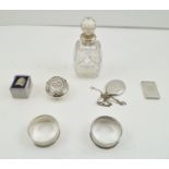 A COLLECTION OF SILVER ITEMS comprising; an embossed silver snuff box, the cover with dancing
