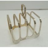 A DECO DESIGN SILVER TOAST RACK by Elkington, 1959, 92g.