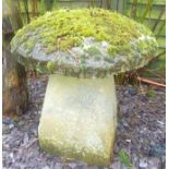 A STONE STADDLE STONE with mushroom cap, 67cm high