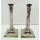 HARRISON BROTHERS & HOWSON A PAIR OF LATE 19TH CENTURY SILVER CANDLESTICKS of classical column form,