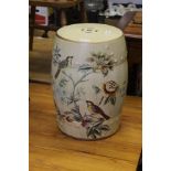AN ORIENTAL DESIGN POTTERY GARDEN BARREL FORMED SEAT, decorated with birds amongst the foliage