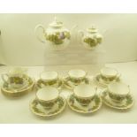 A ROYAL WORCESTER BONE CHINA PART TEA SERVICE "Vine Harvest" pattern, comprising teapot, bachelor