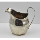 A GEORGE III SILVER CREAM JUG, London 1809, 72g