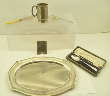 A SILVER SERVING TRAY having shaped edge and engine turned lines to sole, central engraved "D"