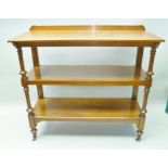 A LATE 19TH CENTURY OAK FINISHED THREE TIER BUFFET with turned and blocked fore supports, plain