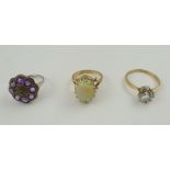 A 9CT GOLD OPAL SET RING together with two costume jewellery rings (3)