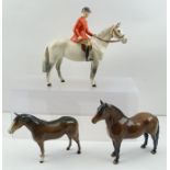 A BESWICK HUNTSMAN on a dapple grey horse, model 1501, gloss finish, 21cm high, together with a