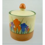 A CLARICE CLIFF BIZARRE CYLINDRICAL PRESERVE JAR WITH COVER, hand-painted in the Rhodanthe pattern