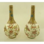 A PAIR OF FRENCH CERAMIC ONION FORM VASES painted with blossoms and butterfly designs, printed marks